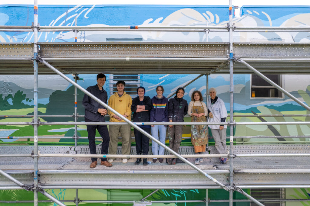 Pullman Riverside Mural in progress with Joe Hedges, WSU painting students, Tori Shao, Sarah Barnett, and Bobbie Rider.